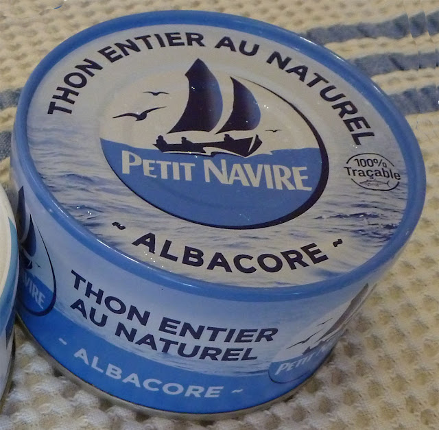 A can of fish on a table

Description automatically generated