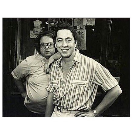 A person leaning back on another person

Description automatically generated