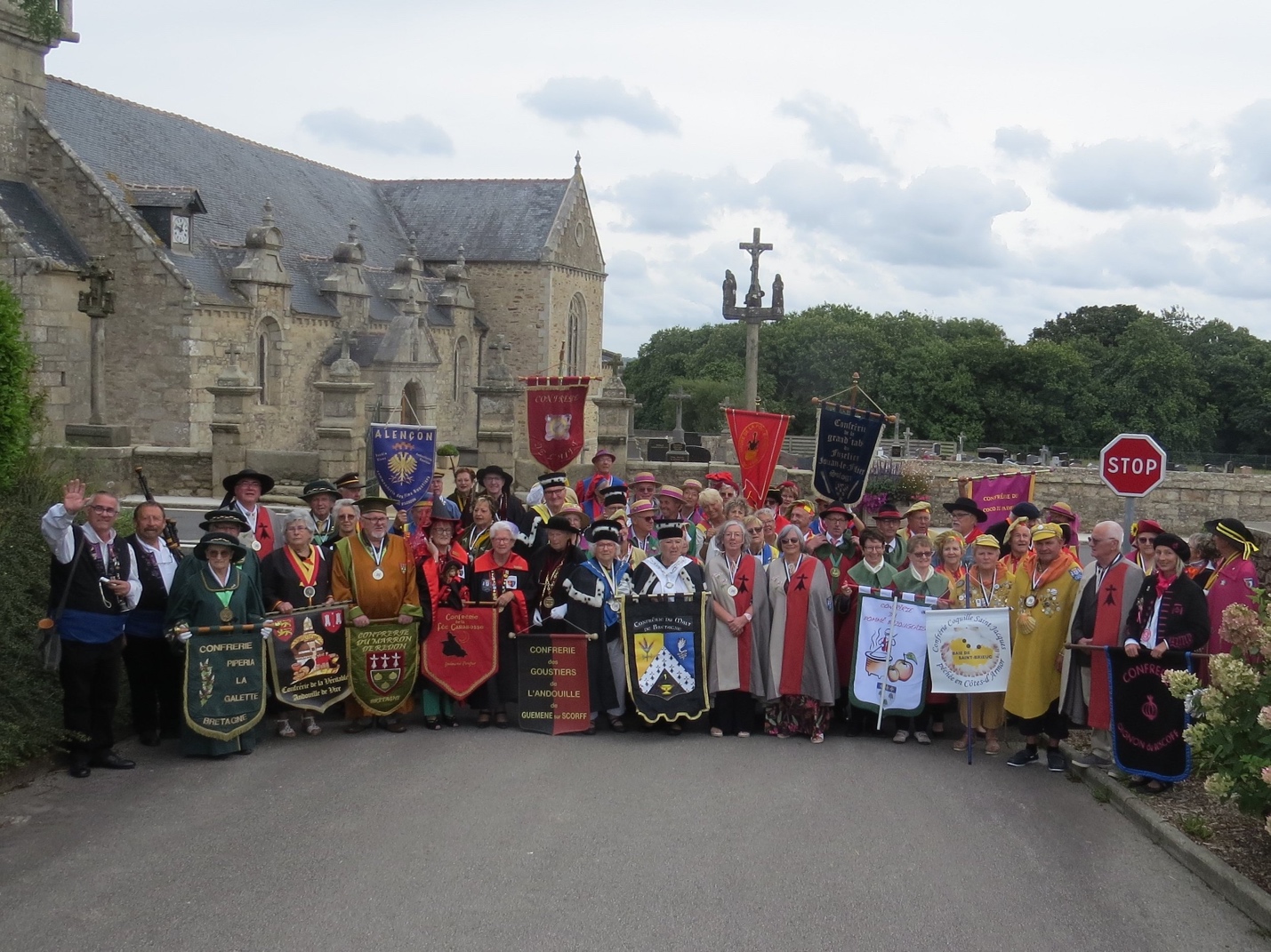 A group of people holding banners

Description automatically generated